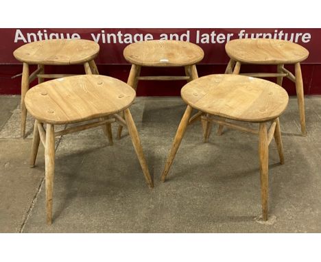 A set of five Ercol Blonde elm and beech stools 