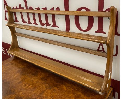 An Ercol Blonde elm and beech Delft rack 