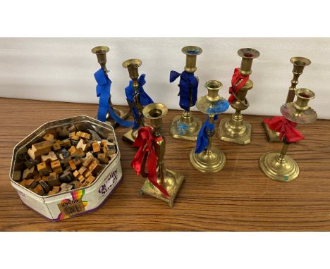 Four pairs of brass candlesticks and assorted vintage wooden stamps 