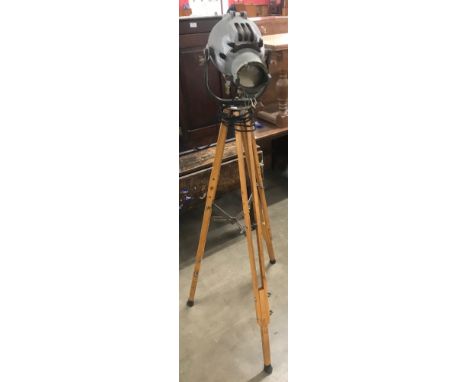 A vintage Strand Electric spotlight on tripod stand 