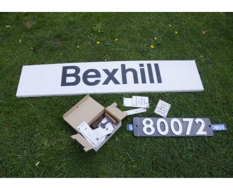 Railway Signs and Memorabilia, a BR black-on-white 'Bexhill' station sign, 12" x 60" long on flanged plastic board, G, a repr