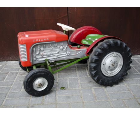 A circa 1969 Tri-ang Massey Ferguson style  ride on Pedal Tractor, plastic and steel construction, red wings, green seat and 