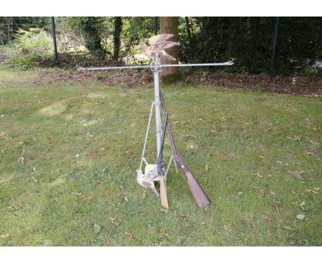 A moving Target and four Toy Rifles two Card Pigeons (one missing) with a metal tripod stand with a  revolving top with three