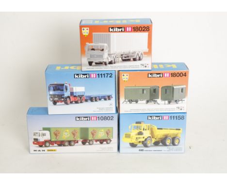 Unmade HO Scale Kit Road Vehicles by Kibri,  thirteen assorted HGV trucks/trailers including cement mixer, mobile crane, dump