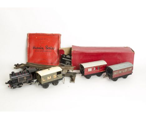 Hornby O Gauge Clockwork Trains, BR black no 40 tank locomotive (mech tested ok), no 2 LNER van, BR coaches and assorted frei