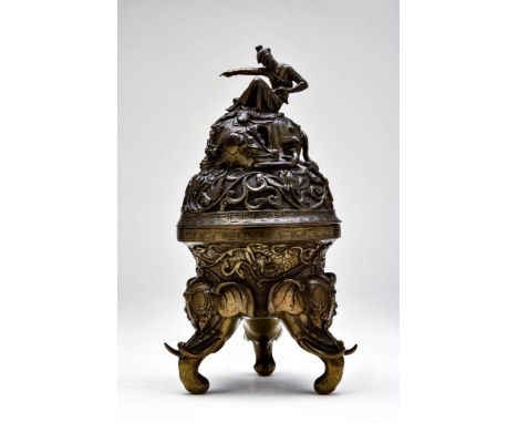 Ca. 18th century AD.
A bronze elephant tripod censer and cover. The body is casted in the form of an inverted bell supported 