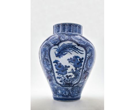 Ca. 17th century AD.A large Arita blue and white jar. Decorated with panels against foliage scrolls, depicting a phoenix and 