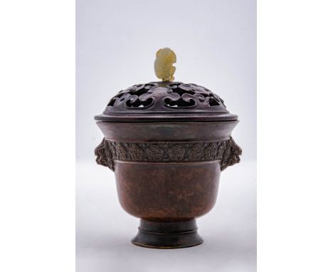 Qing Dynasty, Ca. AD 1644 - 1911.A bronze censer with a reticulated wooden lid and jade finial. The censer is made in the for