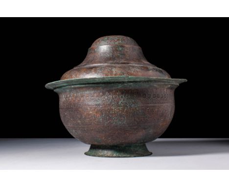 Ca. 13th - 14th century AD. A globular bronze bowl with a lid engraved with a frieze of calligraphic cartouches inscribed in 