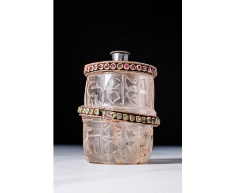 Ca. 18th - 19th century AD.
A rock crystal prayer wheel drum carved with inscriptions. The silver gilt top crusted with paste