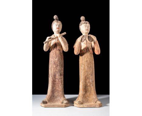 Tang Dynasty, Ca. AD 618-907.
A pair of female musicians. The figures are dressed in long dresses with a short-sleeved croppe