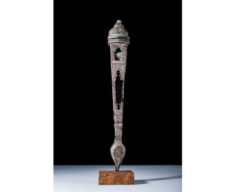 Ca. 12th century AD.
A richly decorated silvered bronze portable pen case of triangular shape comprised of two pieces: an act