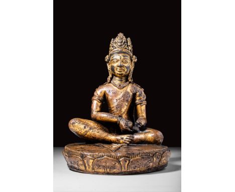 Ca. 9th - 10th century AD.An exceptional gilded bronze bodhisattva. Seated in the padmasana lotus position, the figure is sho