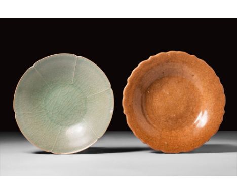 Song Dynasty, Ca. AD 960-1279.
A pair of Longquan dishes, in celadon and yellow glaze respectively.
Size: 125-130mm x 30-40mm