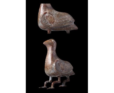 Ca. AD 1100 - 1200 .
A bronze bird figurine presents a captivating representation of avian form and beauty. This freestanding