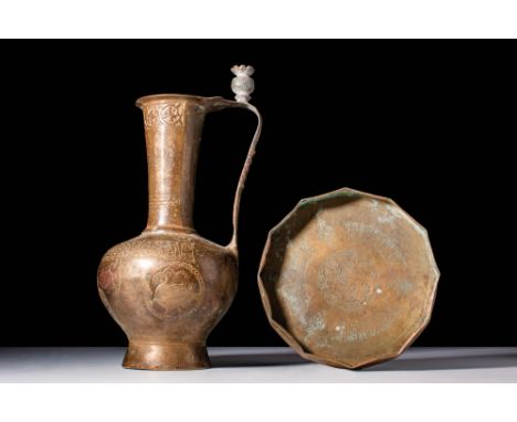 Ca. AD 1200 - 1300.
An ewer with an inverted pear-shaped body resting on an elevated circular foot. The long cylindrical neck