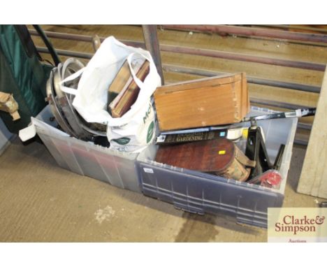 Two plastic boxes of miscellaneous items to include a tennis racket; clock; car jack; windscreen wiper blade; vintage books; 
