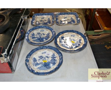 Various blue and white "Willow" pattern plates and dishes, some damaged