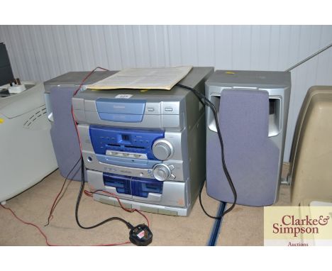 A Goodmans stereo with two speakers and instruction manual