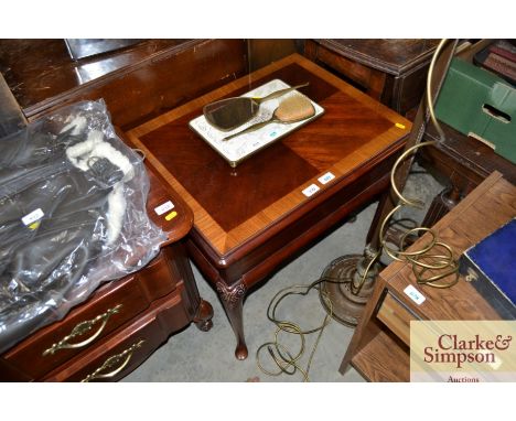 A mahogany and cross banded lamp table 