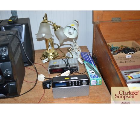 Various electrical items to include a Bush radio; a Bush radio alarm clock; table lamps etc