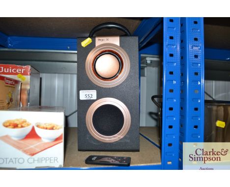 A Vega portable media speaker with remote control