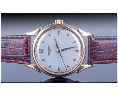 Longines Gents 9ct Gold Cased Wristwatch, circa 1960's. Manual wind, silver dial, gold markers, fitted on a leather strap. Ex
