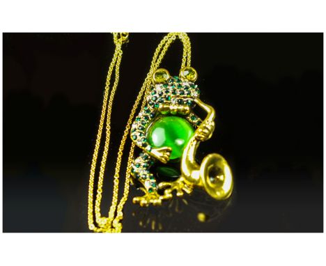 Frog Saxophone Player Pendant or Brooch, the comical frog, of emerald green and white crystals, large green faux cat's eye an