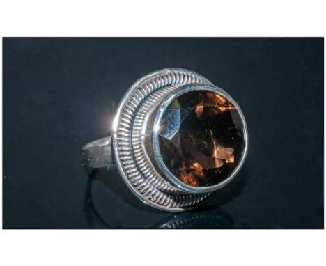Hand Made Smoky Quartz Solitaire Ring, a large round cut smoky quartz of 12.5cts, faceted to the surface edge, bezel set in a