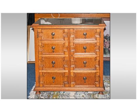 Mock Jacobean Double Door Oak Cupboard the front panelled to simulate a front. On ball feet. The doors open to reveal a shelf