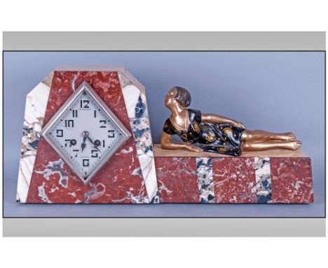 French Le Mans Art Deco Mantle 8 Day Clock circa 1930's. Of stepped & faceted outline, constructed with a clend of marbles-on