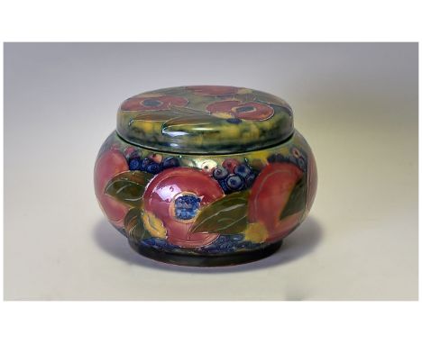 Moorcroft 'Pomegranate and Berries' Lidded Powder Bowl, Signed & dated William Moorcroft 1914. 4'' in height, 5'' in diameter