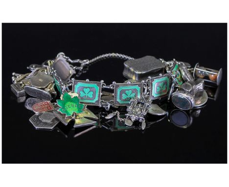 A Good Quality Vintage Silver Charm Bracelet, Loaded with Some Interesting Charms. Marked Silver or Hallmarked. 80.3 grams. 