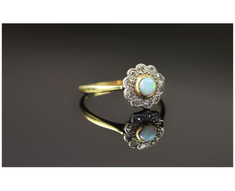 Antique 18ct Gold Set Opal and Diamond Cluster Ring. The Central Opal Surrounded by 12 Small Diamonds. Marked 18ct. 