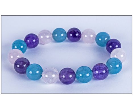 Amethyst, Rose Quartz and Pale Blue Quartzite Bracelet, round beads of the gemstones threaded onto strong jeweller's elastic