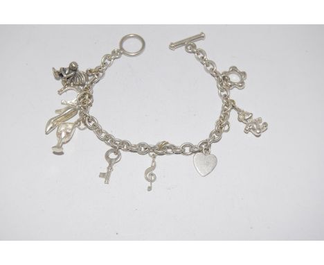 Silver charm bracelet and 9 charms