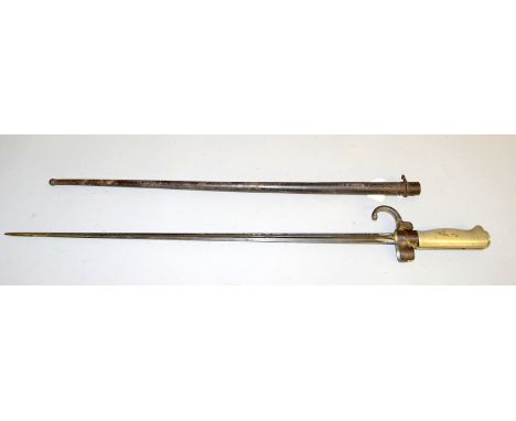 A French model 1886 Epee bayonet with aluminium hilt in its steel scabbard. Blade length 52cms