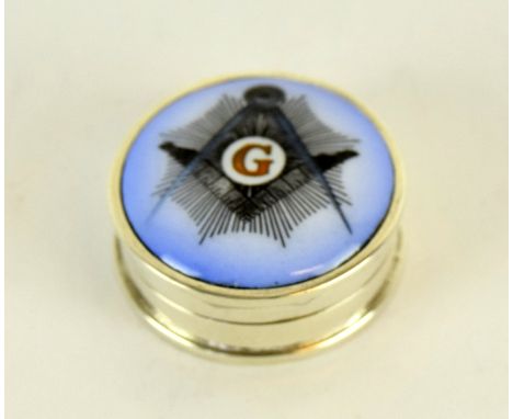 a round silver pill box with enamel Masonic image to the lid