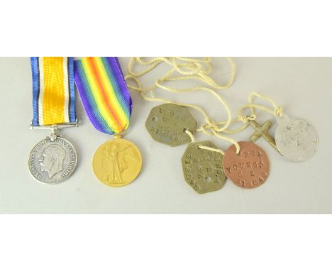 A WW1 medal pair named to M2-048978 Private AJ Young of the Army Service Corps with three fibre ID tags named to 318049 A You