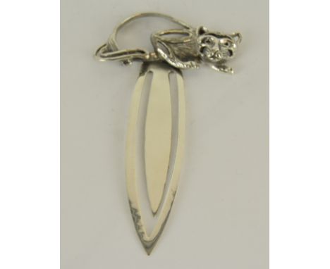 a large silver bookmark with cat finial