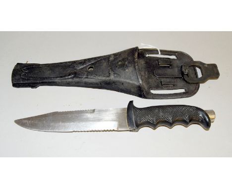 A divers knife with 17cms serrated edged blade in its scabbard