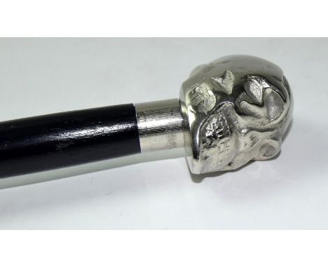 A silver plated ebonized walking cane with skull handle