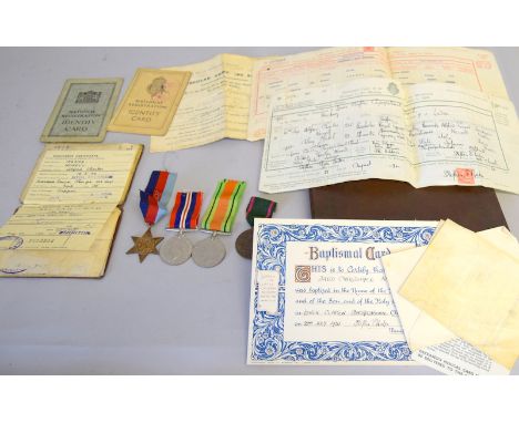 A WW2 group of medals with Army Rifle Association medal with his pay book and other military and personal documents including