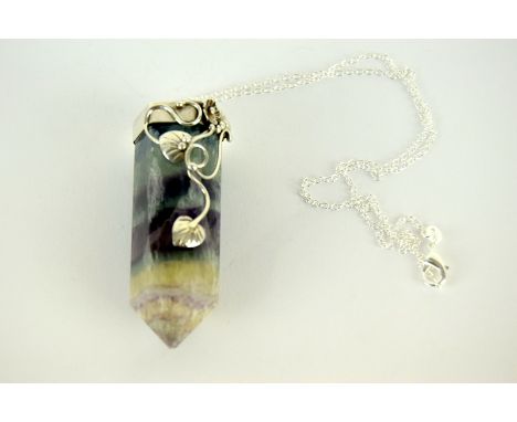 a substantial amethyst and crystal pendant necklace with silver fittings