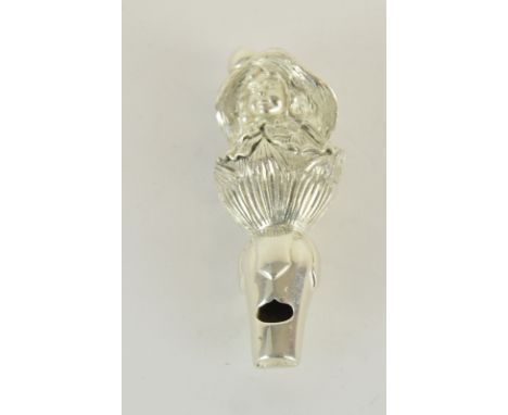 an unusual silver whistle in the shape of a young lady with a bonnet
