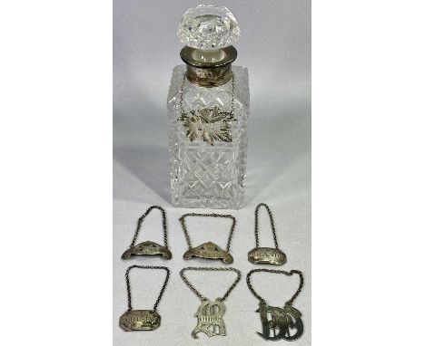 GEORGE III &amp; LATER SILVER &amp; WHITE METAL DRINKS DECANTER LABELS and a cut glass square decanter and stopper with silve