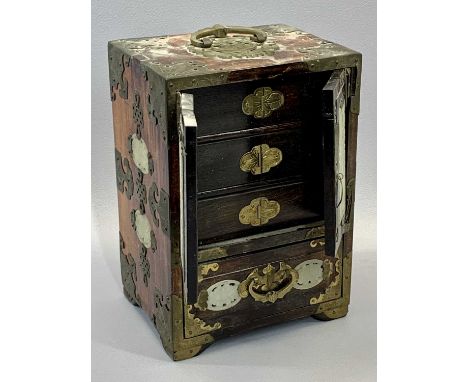 CHINESE HARDWOOD GLASS BOUND TABLE JEWELLERY CABINET - inset with pierced celadon jade panels, two doors enclosing three draw