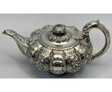 SILVER TEAPOT - of squat pumpkin form with floral and shell embossing, leaf decorated handles and knop, London 1825, Maker Wi