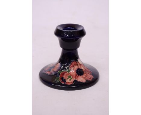 A MOORCROFT CANDLESTICK IN ANEMONE PATTERN 