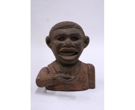 A VINTAGE CAST 'LITTLE JOE' MONEY BANK Notice from the the-saleroom.com: These items are listed on the basis they are illustr